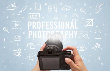 Photo for Hand taking picture with digital camera and PROFESSIONAL PHOTOGRAPHY inscription, camera settings concept - Royalty Free Image