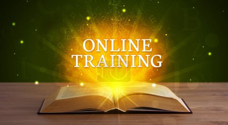 Photo for ONLINE TRAINING inscription coming out from an open book, educational concept - Royalty Free Image