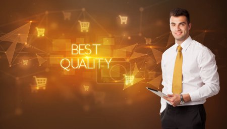 Photo for Businessman with shopping cart icons and BEST QUALITY inscription, online shopping concept - Royalty Free Image