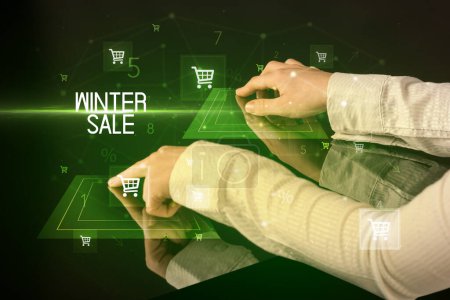Photo for Online shopping with WINTER SALE inscription concept, with shopping cart icons - Royalty Free Image