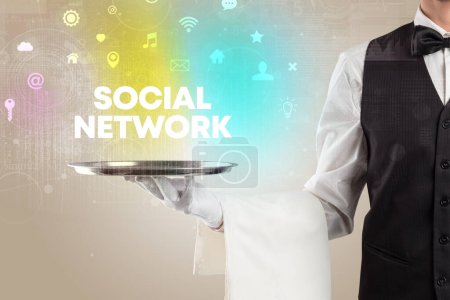 Photo for Waiter serving social networking with SOCIAL NETWORK inscription, new media concept - Royalty Free Image
