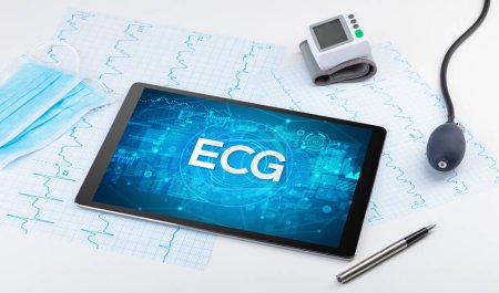 Photo for Close-up view of a tablet pc with ECG abbreviation, medical concept - Royalty Free Image