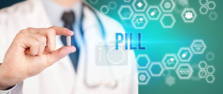 Photo for Close-up of a doctor giving you a pill with PILL inscription, medical concept - Royalty Free Image