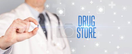 Photo for Close-up of a doctor giving a pill with DRUG STORE inscription, medical concept - Royalty Free Image