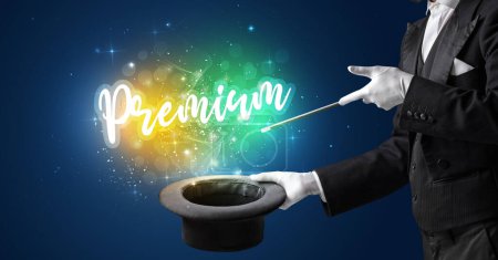 Photo for Magician hand conjure with wand and Premium inscription, shopping concept - Royalty Free Image