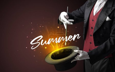 Photo for Magician is showing magic trick with Summer inscription, traveling concept - Royalty Free Image