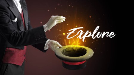 Photo for Magician is showing magic trick with Explore inscription, traveling concept - Royalty Free Image