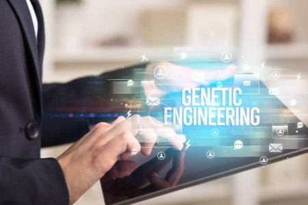Photo for Close-up of a tablet searching GENETIC ENGINEERING inscription, modern technology concept - Royalty Free Image