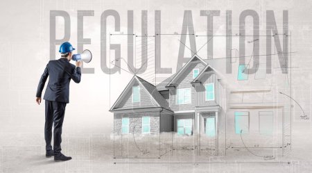Photo for Young engineer holding blueprint with REGULATION inscription, house planning concept - Royalty Free Image