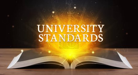 Photo for UNIVERSITY STANDARDS inscription coming out from an open book, educational concept - Royalty Free Image