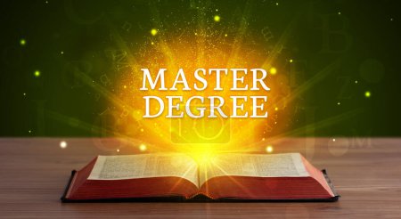 Photo for MASTER DEGREE inscription coming out from an open book, educational concept - Royalty Free Image