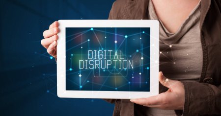 Photo for Young business person working on tablet and shows the digital sign: DIGITAL DISRUPTION - Royalty Free Image
