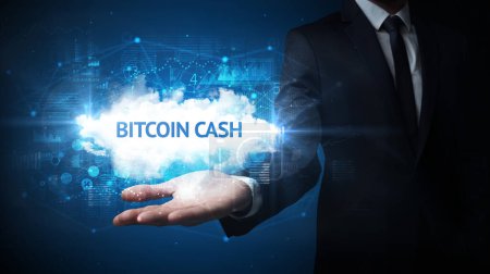 Photo for Hand of Businessman holding BITCOIN CASH inscription, successful business concept - Royalty Free Image