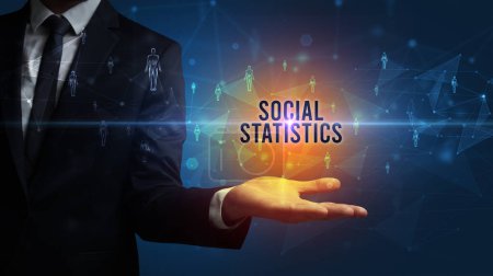 Photo for Elegant hand holding SOCIAL STATISTICS inscription, social networking concept - Royalty Free Image