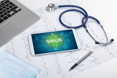 Photo for Tablet pc and doctor tools with VIRUS inscription, coronavirus concept - Royalty Free Image