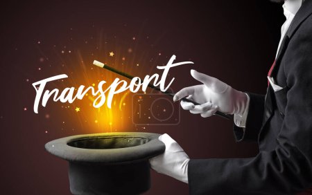 Photo for Magician is showing magic trick with Transport inscription, traveling concept - Royalty Free Image