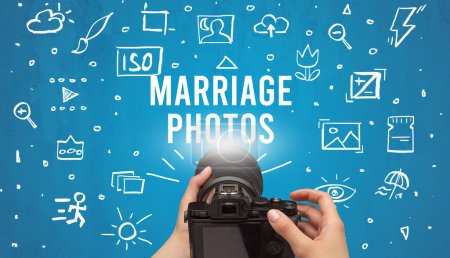 Photo for Hand taking picture with digital camera and MARRIAGE PHOTOS inscription, camera settings concept - Royalty Free Image