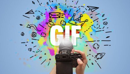Foto de Primer plano de una cámara digital de mano con dibujo abstracto e inscripción GIF - Imagen libre de derechos