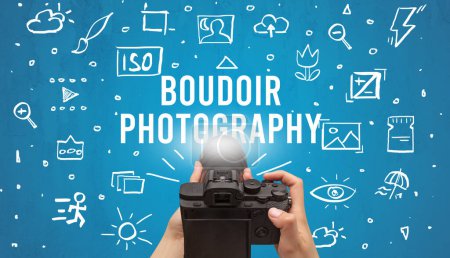 Photo for Hand taking picture with digital camera and BOUDOIR PHOTOGRAPHY inscription, camera settings concept - Royalty Free Image