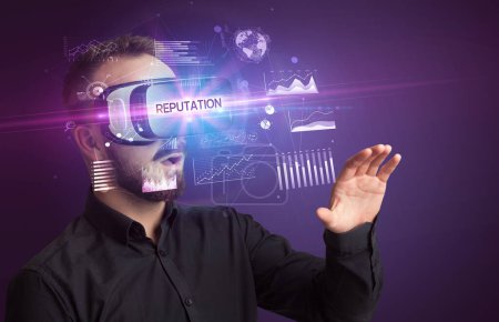 Photo for Businessman looking through Virtual Reality glasses with REPUTATION inscription, new business concept - Royalty Free Image