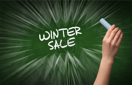 Photo for Hand drawing WINTER SALE inscription with white chalk on blackboard, online shopping concept - Royalty Free Image