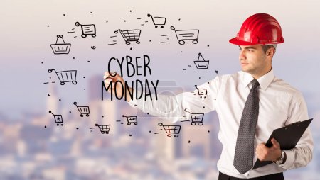 Photo for Handsome businessman with helmet drawing CYBER MONDAY inscription, contruction sale concept - Royalty Free Image