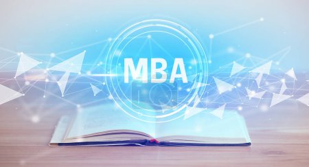 Photo for Open book with MBA abbreviation, modern technology concept - Royalty Free Image