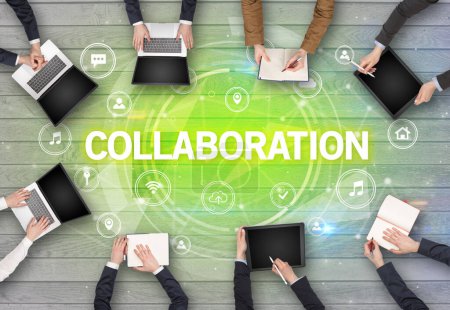 Photo for Group of people having a meeting with COLLABORATION insciption, social networking concept - Royalty Free Image