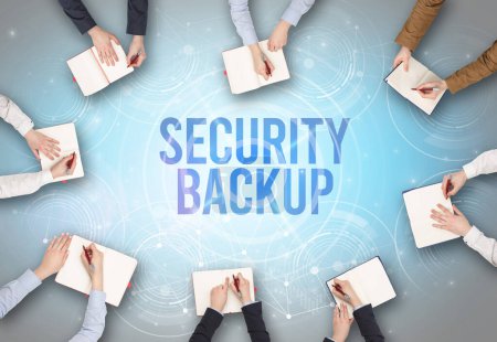 Photo for Group of people in front of a laptop with SECURITY BACKUP insciption, web security concept - Royalty Free Image
