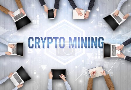 Photo for Group of Busy People Working in an Office with CRYPTO MINING inscription, modern technology concept - Royalty Free Image