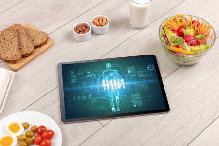 Foto de Concepto H1N1 en tableta con frutas, vista superior - Imagen libre de derechos