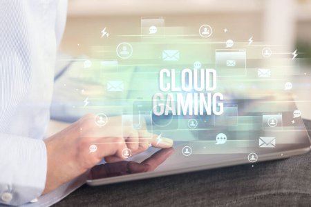 Photo for Close-up of a tablet searching CLOUD GAMING inscription, modern technology concept - Royalty Free Image