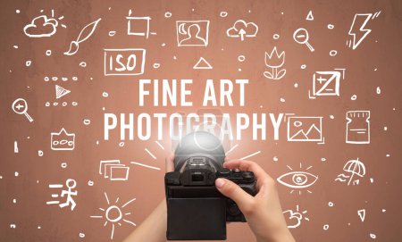 Photo for Hand taking picture with digital camera and FINE ART PHOTOGRAPHY inscription, camera settings concept - Royalty Free Image
