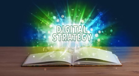 Photo for DIGITAL STRATEGY inscription coming out from an open book, educational concept - Royalty Free Image