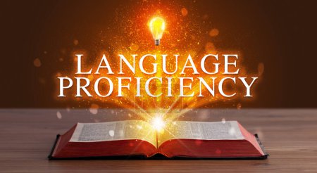 Photo for LANGUAGE PROFICIENCY inscription coming out from an open book, educational concept - Royalty Free Image