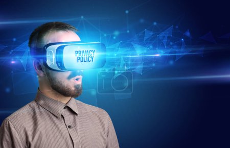 Photo for Businessman looking through Virtual Reality glasses with PRIVACY POLICY inscription, cyber security concept - Royalty Free Image