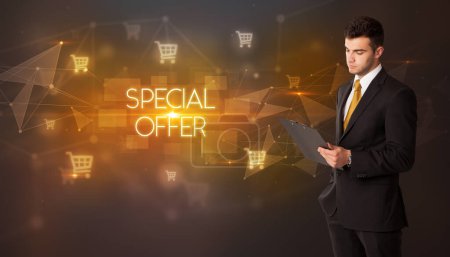 Photo for Businessman with shopping cart icons and SPECIAL OFFER inscription, online shopping concept - Royalty Free Image