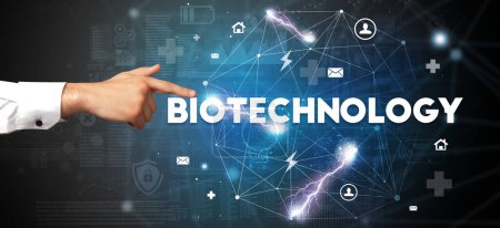 Photo for Hand pointing at BIOTECHNOLOGY inscription, modern technology concept - Royalty Free Image