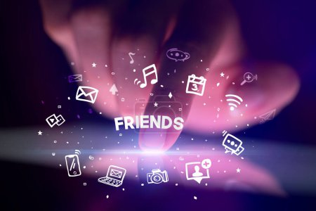 Photo for Finger touching tablet with drawn social media icons and FRIENDS inscription, social networking concept - Royalty Free Image