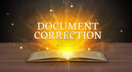Photo for DOCUMENT CORRECTION inscription coming out from an open book, educational concept - Royalty Free Image