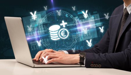 Photo for Business hand working in stock market with euro funds icons coming out from laptop screen - Royalty Free Image