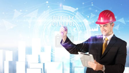 Photo for Handsome businessman with helmet drawing QUALITY CONTROL inscription, contruction business concept - Royalty Free Image