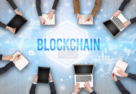 Photo for Group of Busy People Working in an Office with BLOCKCHAIN inscription, modern technology concept - Royalty Free Image