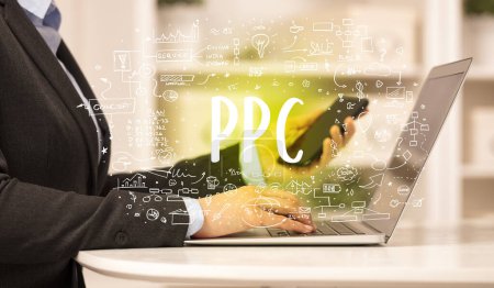 Photo for Hand working on new modern computer with PPC abbreviation, modern technology concept - Royalty Free Image