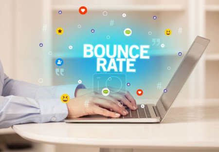 Photo for Freelance woman using laptop with BOUNCE RATE inscription, Social media concept - Royalty Free Image