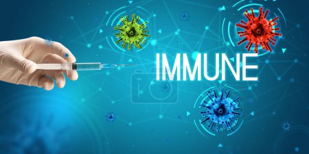 Photo for Syringe, medical injection in hand with IMMUNE inscription, coronavirus vaccine concept - Royalty Free Image
