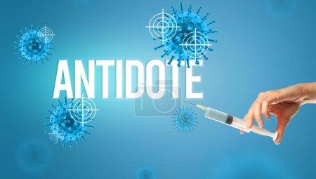 Photo for Close-up view of doctors hand in a white glove holding syringe with ANTIDOTE inscription, coronavirus antidote concept - Royalty Free Image