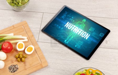 Téléchargez les photos : Concept NUTRITION en tablette avec fruits, vue du dessus - en image libre de droit