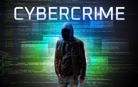 Photo for Faceless hacker with CYBERCRIME inscription on a binary code background - Royalty Free Image