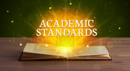 Photo for ACADEMIC STANDARDS inscription coming out from an open book, educational concept - Royalty Free Image